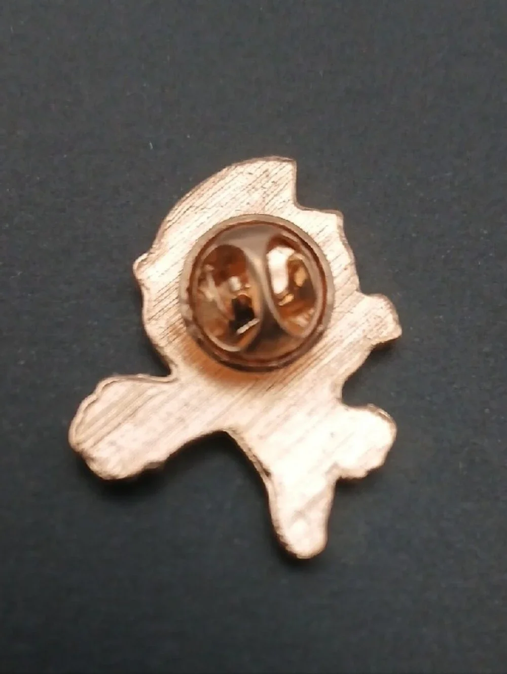This is a chibi-style Ultraman enamel lapel pin